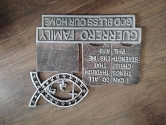 Family name outside house wall plack..