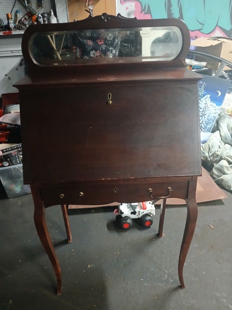 Antique Desk With Drawer At The Bottom And A Mirror On The Top