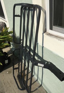 Luggage carrier for the back of a vehicle