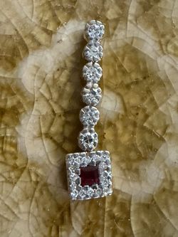 14k yellow gold ruby and diamond accent pendant