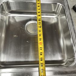 The brand is Just, stainless steel kitchen sink