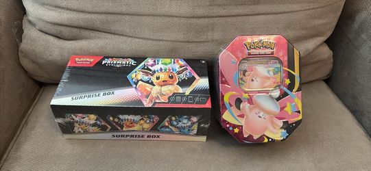 Prismatic evolutions suprise box and mega clefsble tin