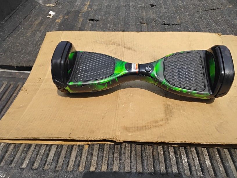 1- Nice Is Electric Skateboard Green In Color Like New.