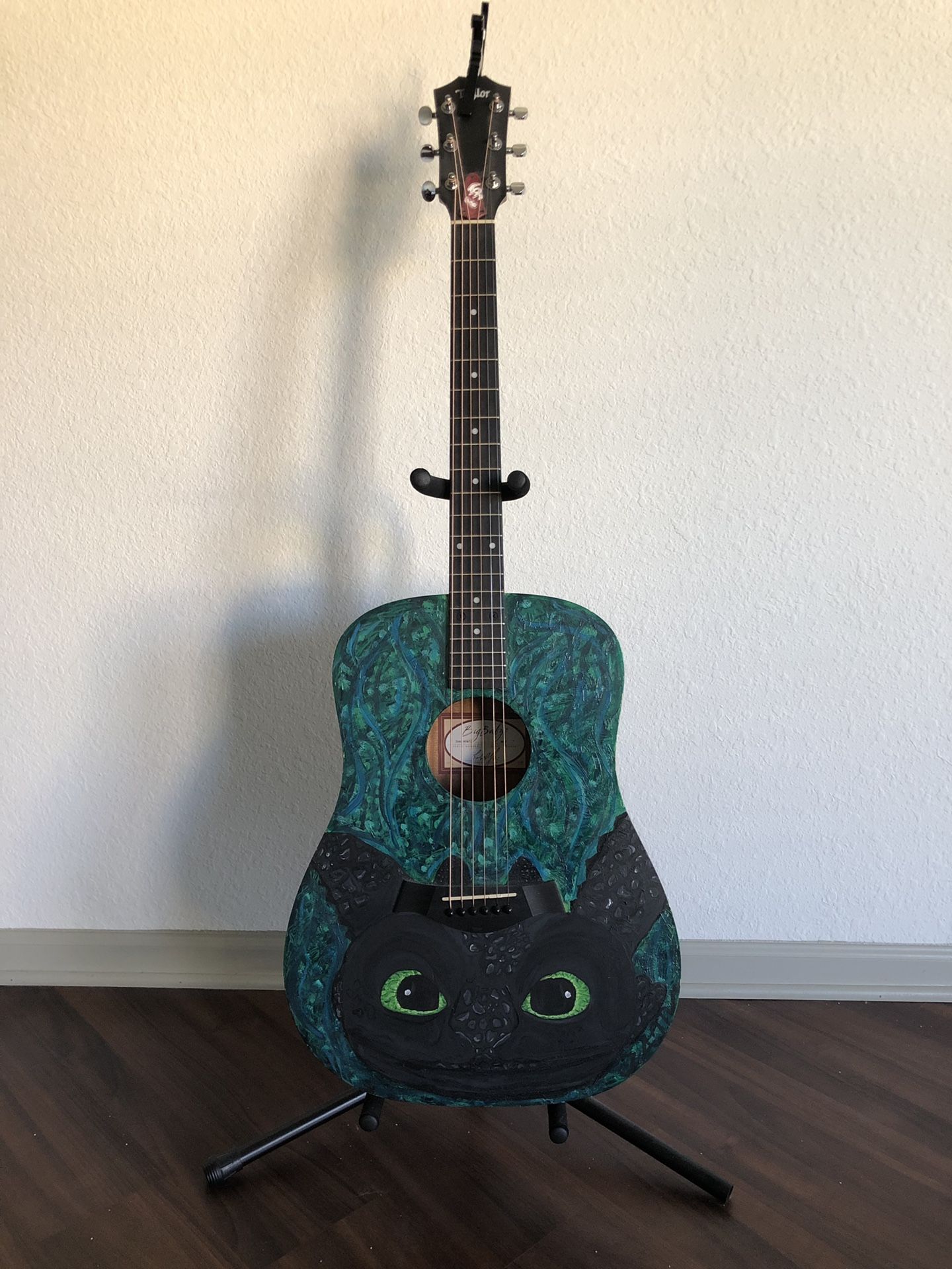 Custom painted Big Baby Taylor acoustic guitar with carrying case, capo, and stand