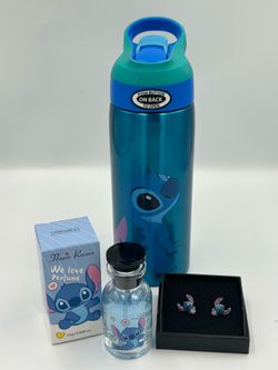The Cutie 3pc Stitch Bundle includes a Pair of Cute Enamel and Silver Stitch Stud Earrings, an 19oz Stitch Stitch Tumbler and An 26ml bottle of Flower