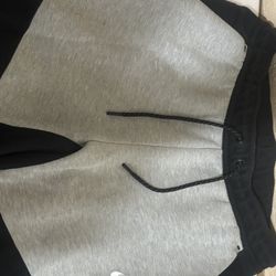 grey and black nike tech pants