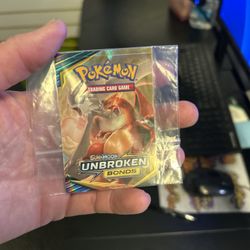 Pokémon Unbroken Bonds Charizard & Reshiram Promo Sticker Original retail packaging sticker – great for display or collection Condition: clean, no tea