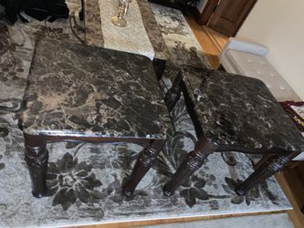 Two brown marble side tables