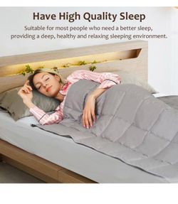 All new 48”x72” light gray quilted 12 lbs blanket