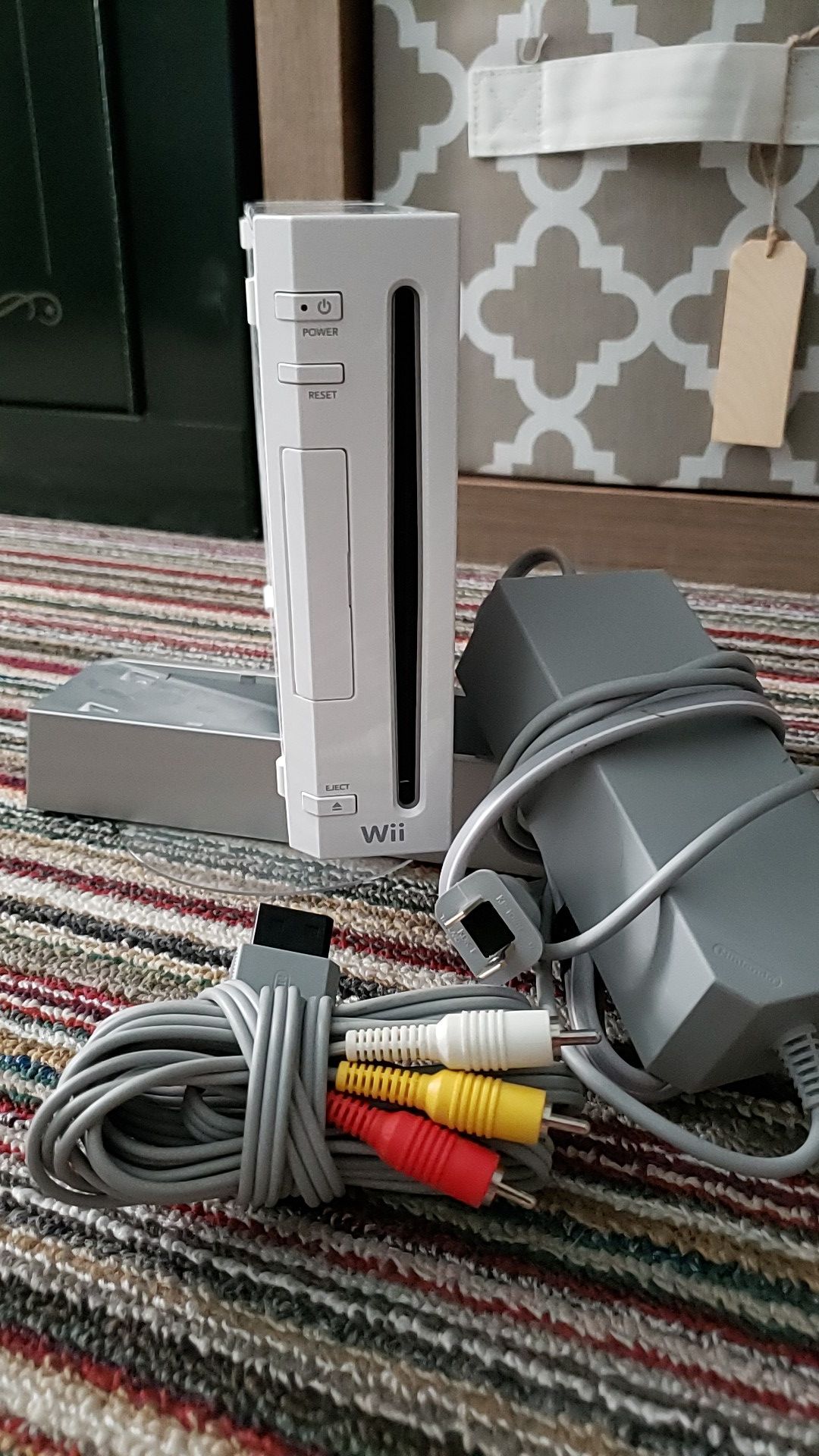 Wii console with stand, plug, and adapters