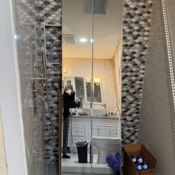 140 3/7 MIRRORED FOLDING DOOR. 23 1/2"w x 78 1/2" tall; cross streets are Arapaho & Waterview 