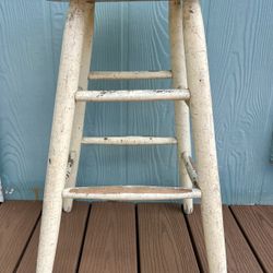 Vintage, rustic farmhouse-style wooden stool 