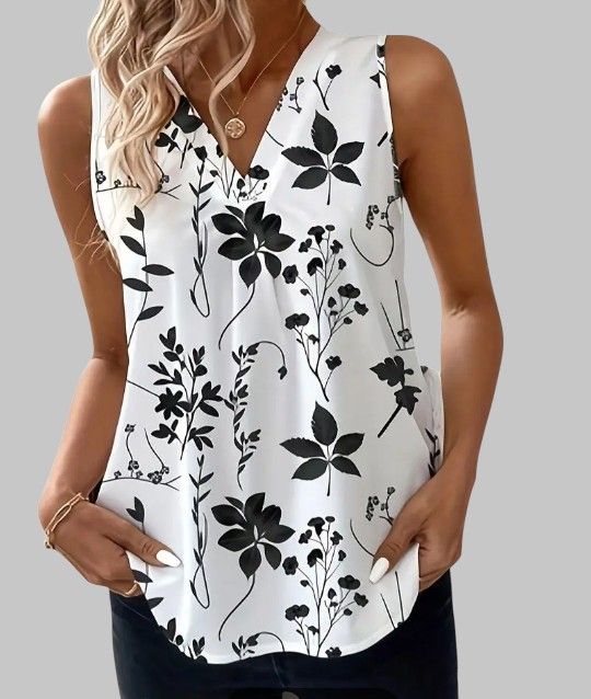 Please see Chart for size before ordering.
New Large Women's Flower Tank Tunic Style Blouse. Dress up or dress down.
Beautiful and Comfortable w