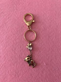Gold teddy bear with pink heart