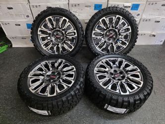 22" GM style rims w/ 33" MT tires. $1750