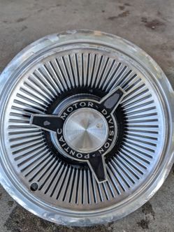 1964/65 OEM  14 inch Pontiac  spinner hubcaps