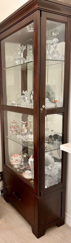 China Cabinet With A Back Mirror And Light On Top Width 27 “ ,height 78 “, depth 13.5”