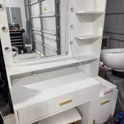 white vanity with mirror and stool