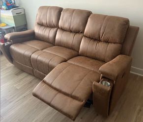 Brand new brown reclining sofa /w pullout cup holders