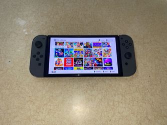 NNTENDO SWITCH OLED with 125 POPULAR SWITCH GAMES and 7500 CLASSIC GAMES