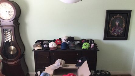 19 Baseball caps.   Mostly Disney