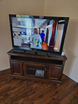 RCA 50 inch TV and a beautiful entatiment cabinet
