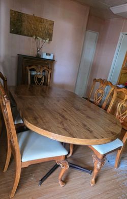Dining table with 6 chairs and hutch