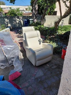 Two leather reclining chairs
