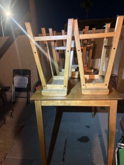 Table with 4 /‘stool chairs so will over white paint & supplies if your wanting to change color.