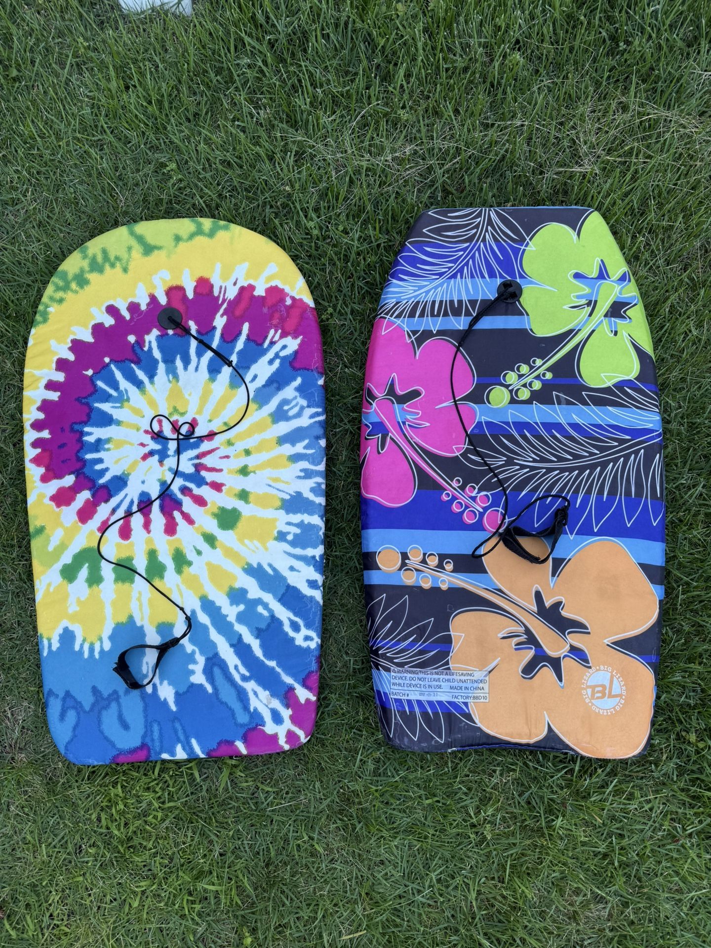 Two boogie boards with tether straps