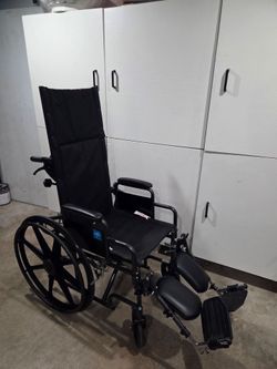 Wheelchair with foot rest and extra neck support