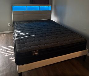 Queen-size bed and mattress