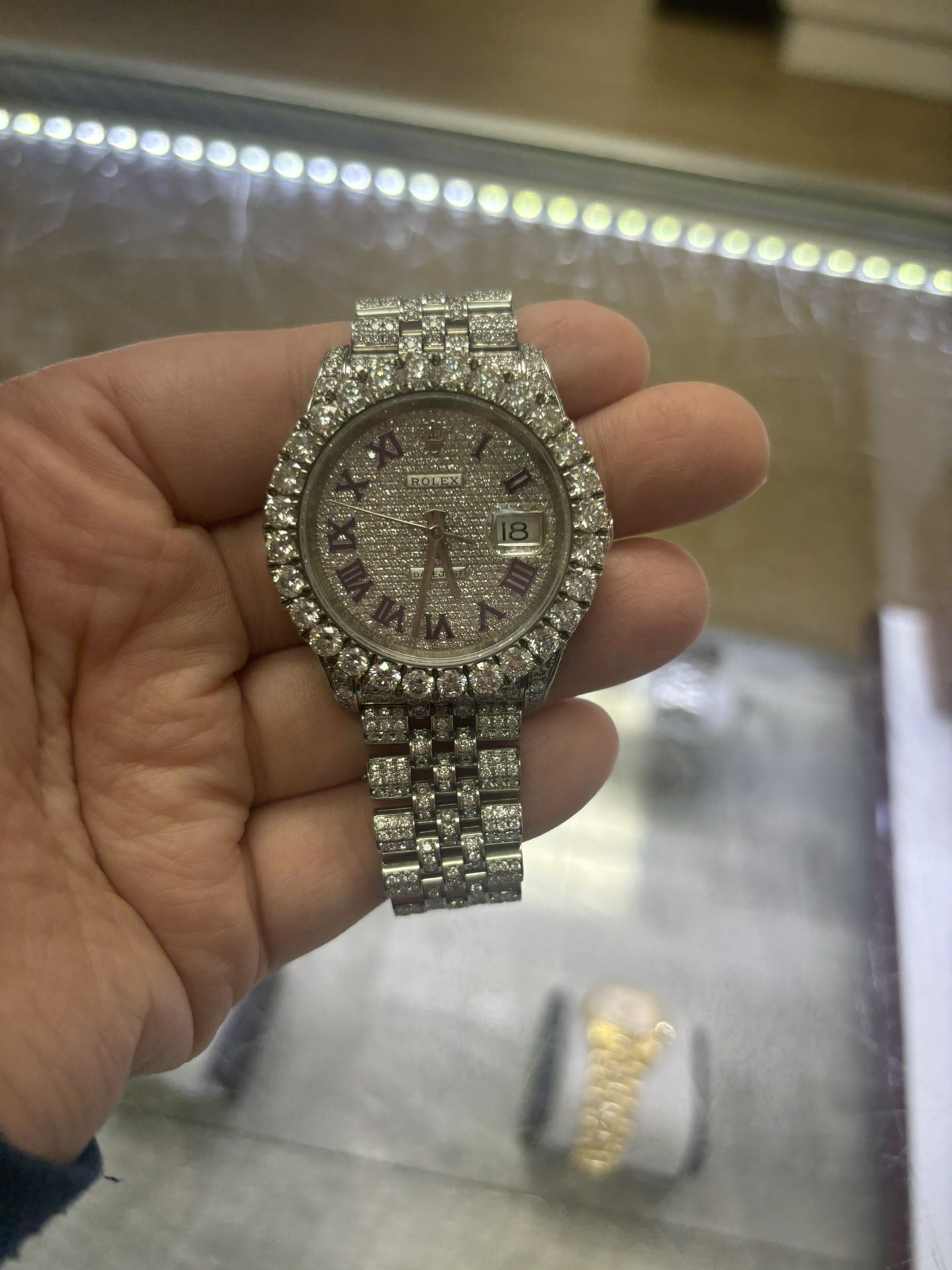 Iced out rolex