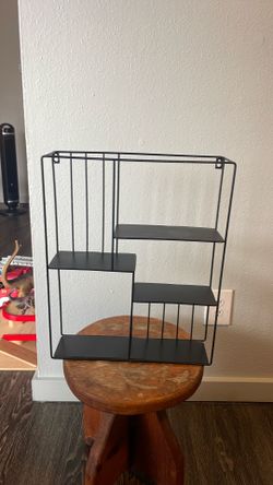 Black metal hanging shelf