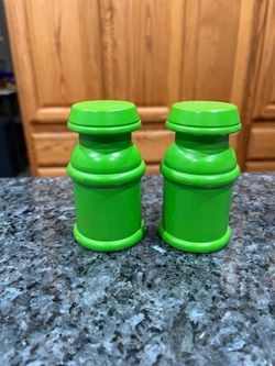 Vintage Wood Green pair of salt and pepper shakers. Size approximately 3 1/2 inches tall. Preowned. Minor pair wear see pictures and a couple on mi