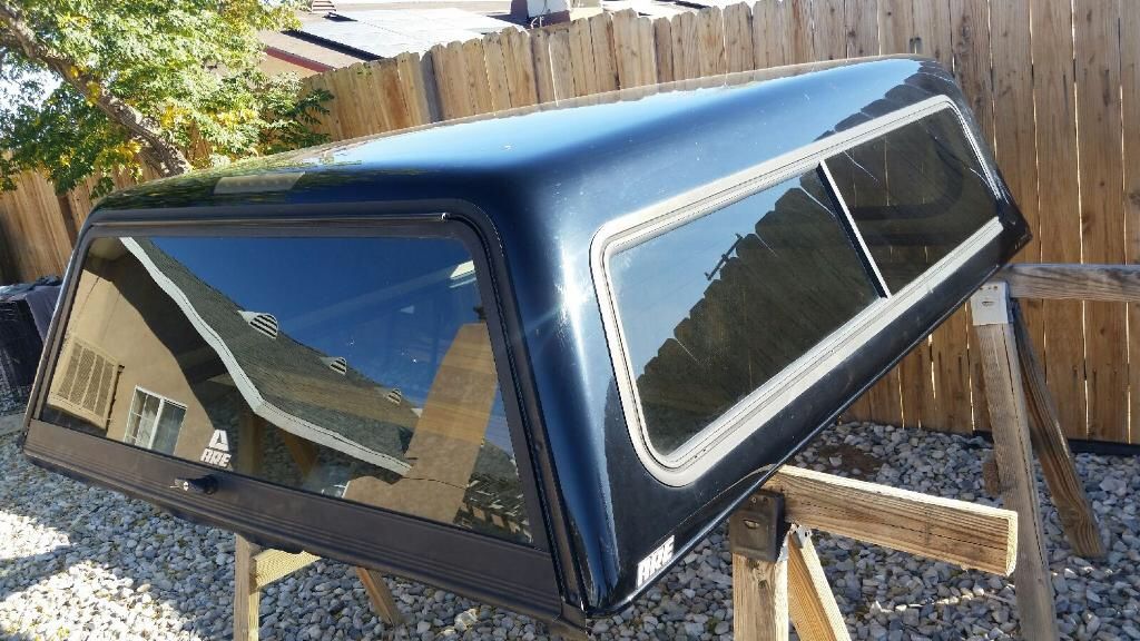 Fiberglass camper shell will fit Chevy Silverado and Ford F-150 6.5 ft bed