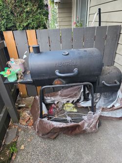 Charcoal BBQ Pit with small smoker