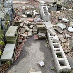 assorted cinder blocks, pavers, and bricks 