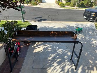 Adjustable over-bed desk with wheels