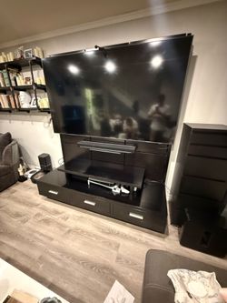 TV stand made from solid real wood. Built like a tank and heavy as hell.