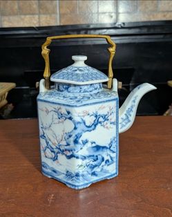 7" x 7" Vintage Dolphin China Dynasty hexagonal porcelain teapot with a brass handle