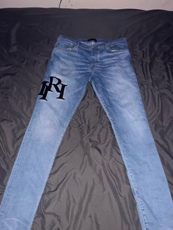 AMIRI JEANS STAGGERED BLACK LOGO