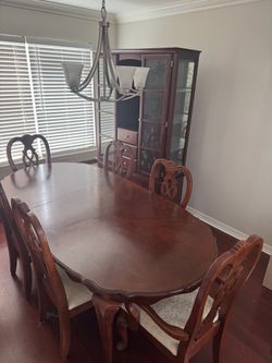 Elegant dining set with six chairs and cabinet