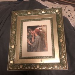 Picture of a woman smelling a flower