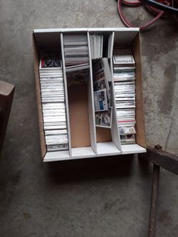 Box of football, baseball, and basketball cards