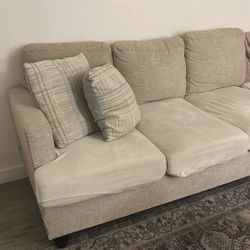 beige L shaped sofa 