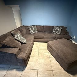 Brown Sectional, Ottoman And Throw Pillows 