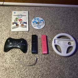 Some Wii Controllers And Wii Games