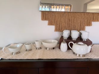 White ceramic tea set and matching dishes