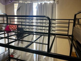 Lots of girl toys blankets an bunk bed